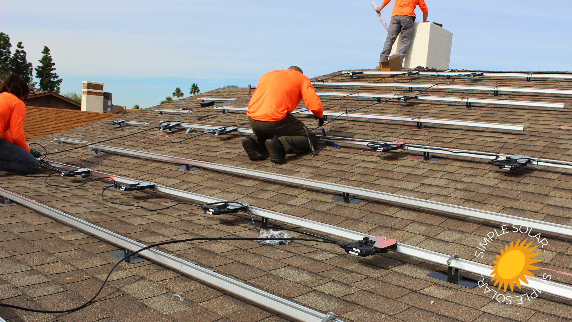 Racking installed, mounting and connecting Enphase Micro-Inverters.