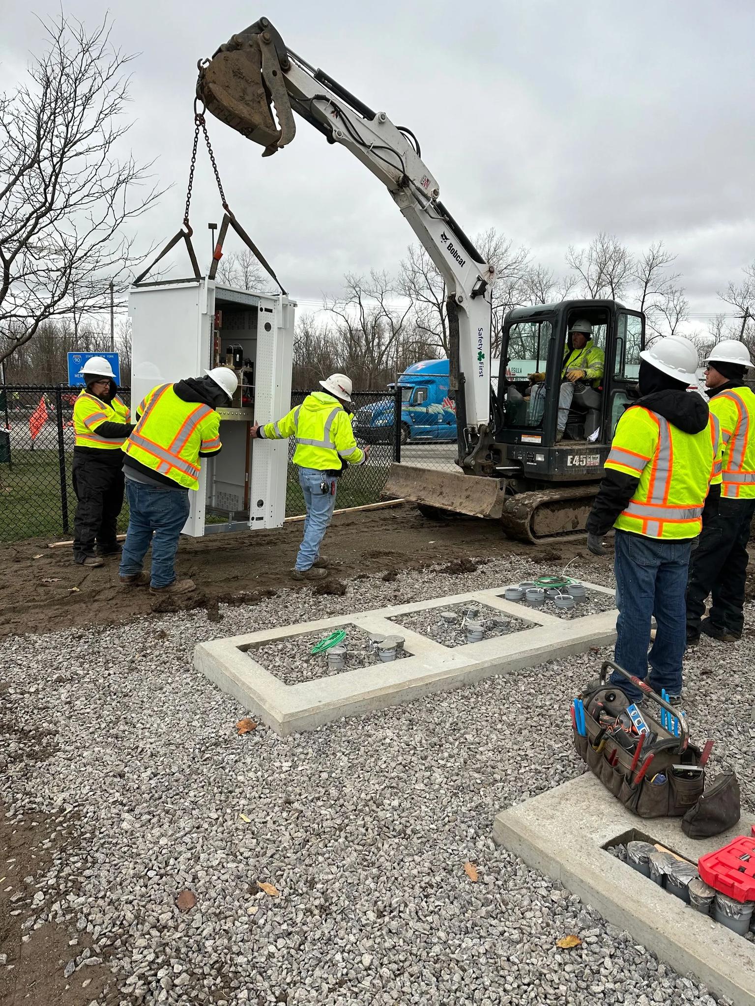 Team members working on EV charging station installs.