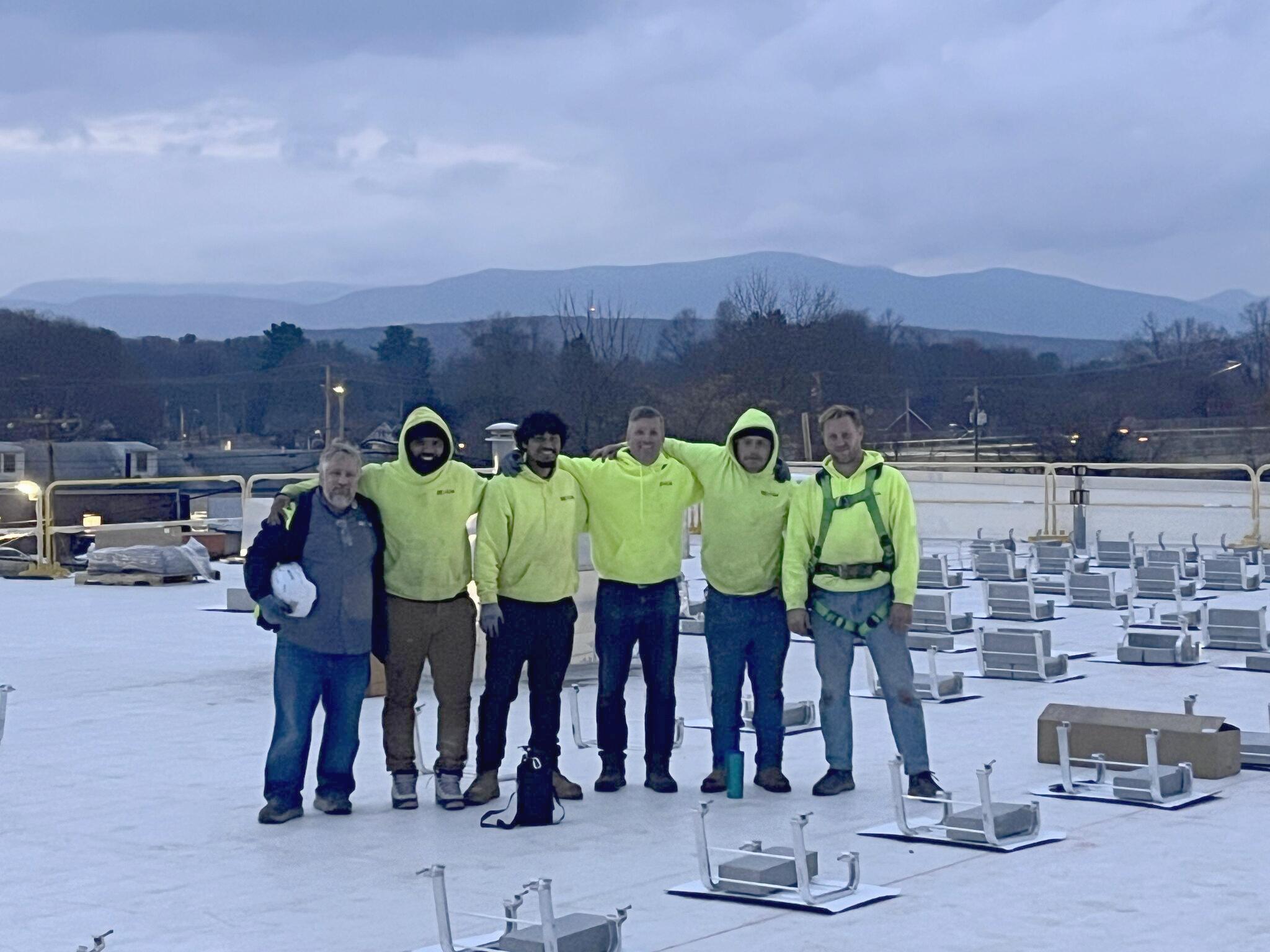 Team members at Lia Honda solar installation.