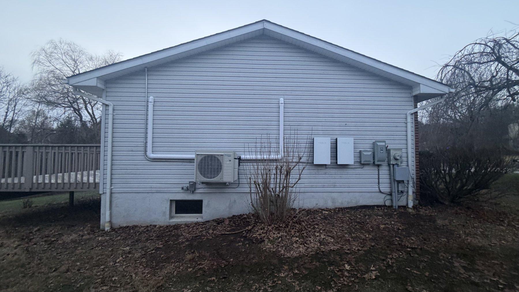 Outdoor heat pump unit installed on a home