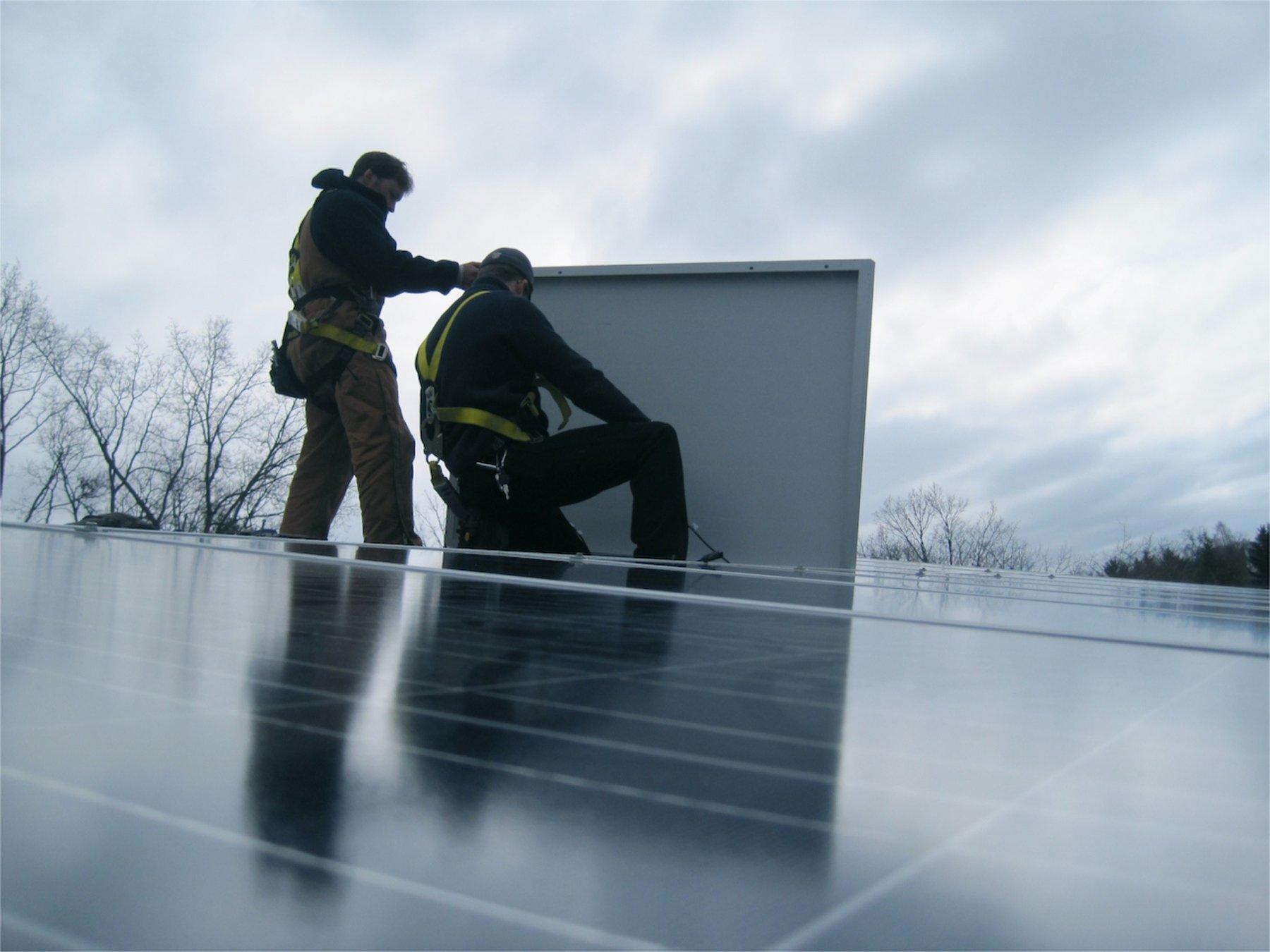Our installers at work on a roof