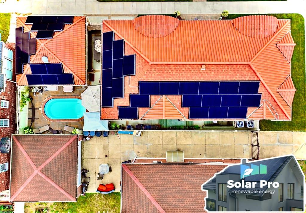 Solar panels on a tile-roof home with a pool