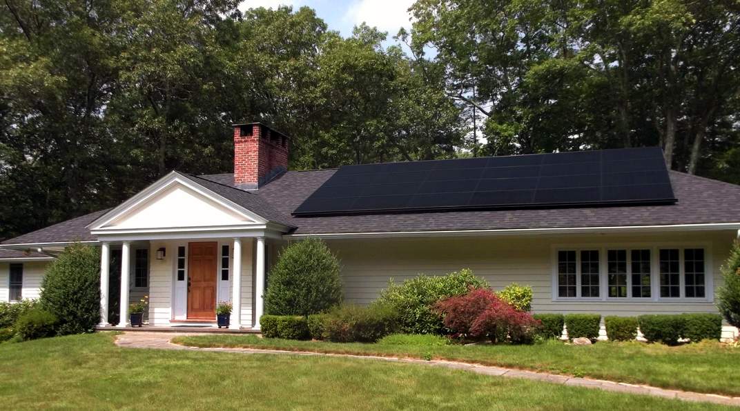 All-black SunPower solar panels on a ranch in Tewksbury, MA