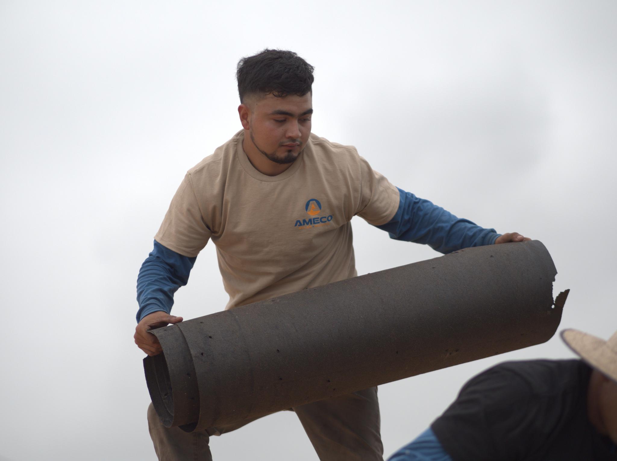 Our dedicated crew hard at work, crafting the perfect roof to protect your home.