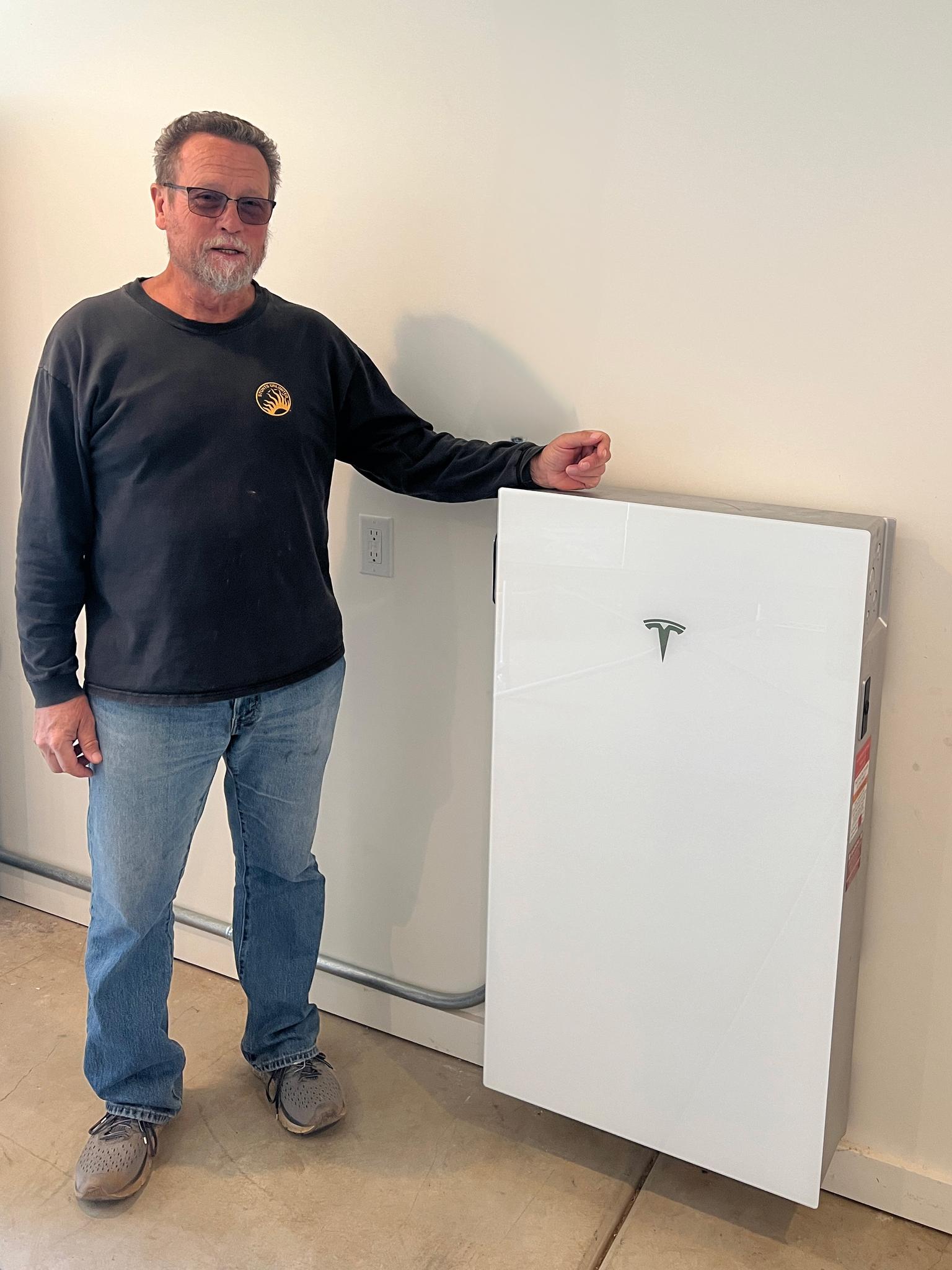 A happy customer with his new Tesla Powerwall
