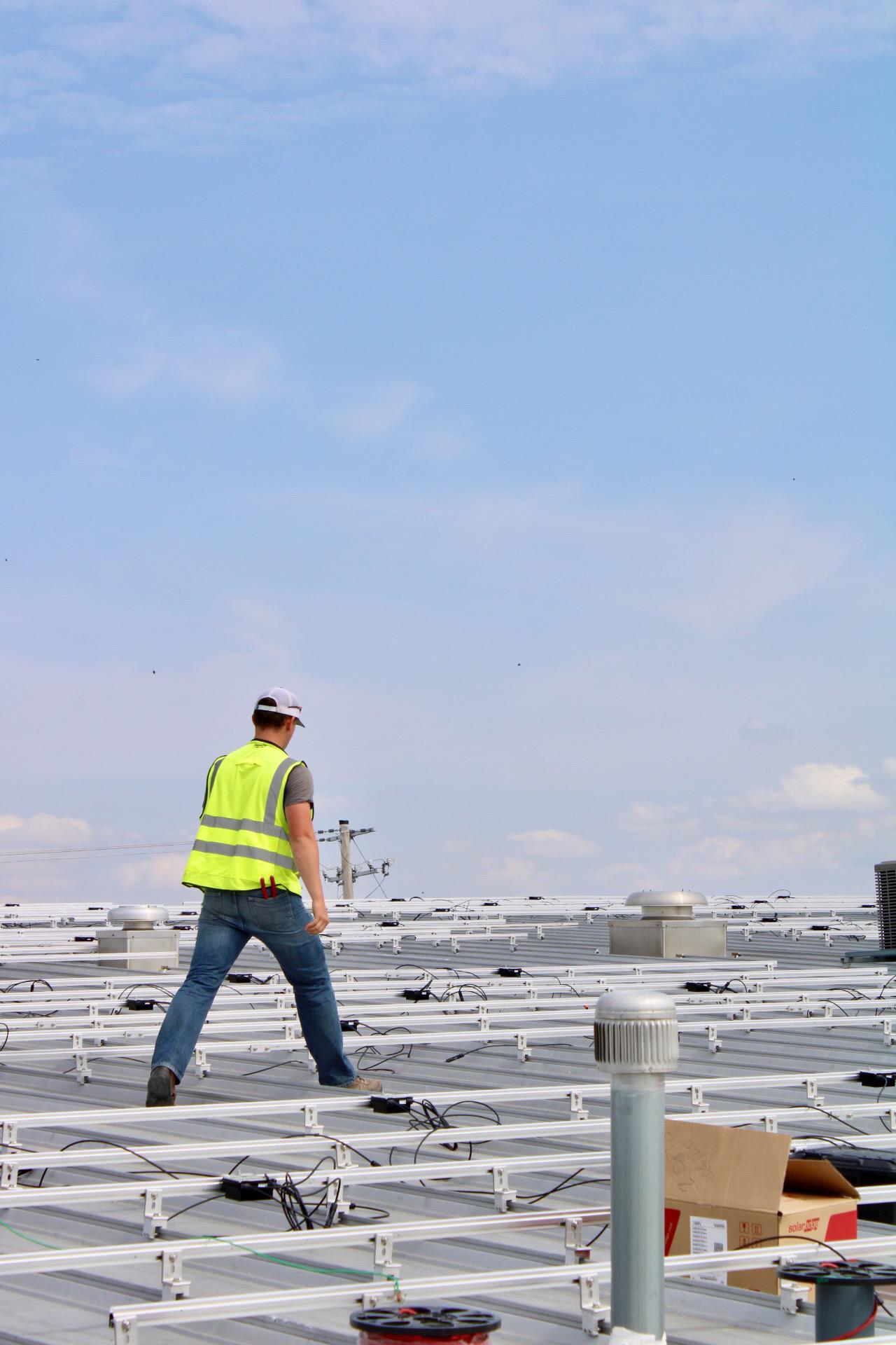 Power Sync Solar installer at Newell Coach in Miami, OK