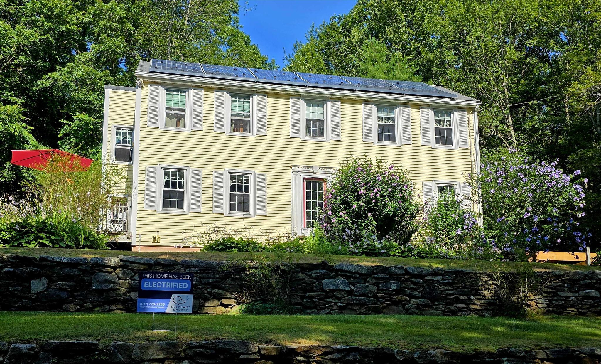 Electrified home with a heat pump and solar panels in Massachusetts