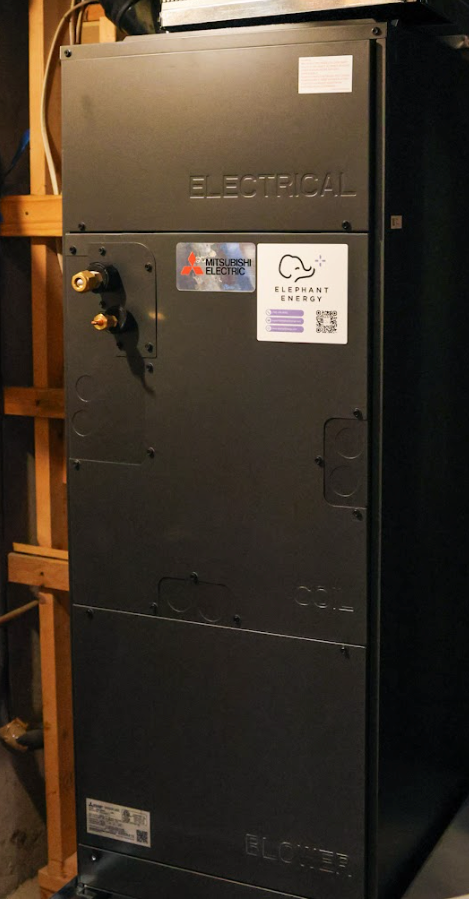Mitsubishi heat pump air handler in a utility closet