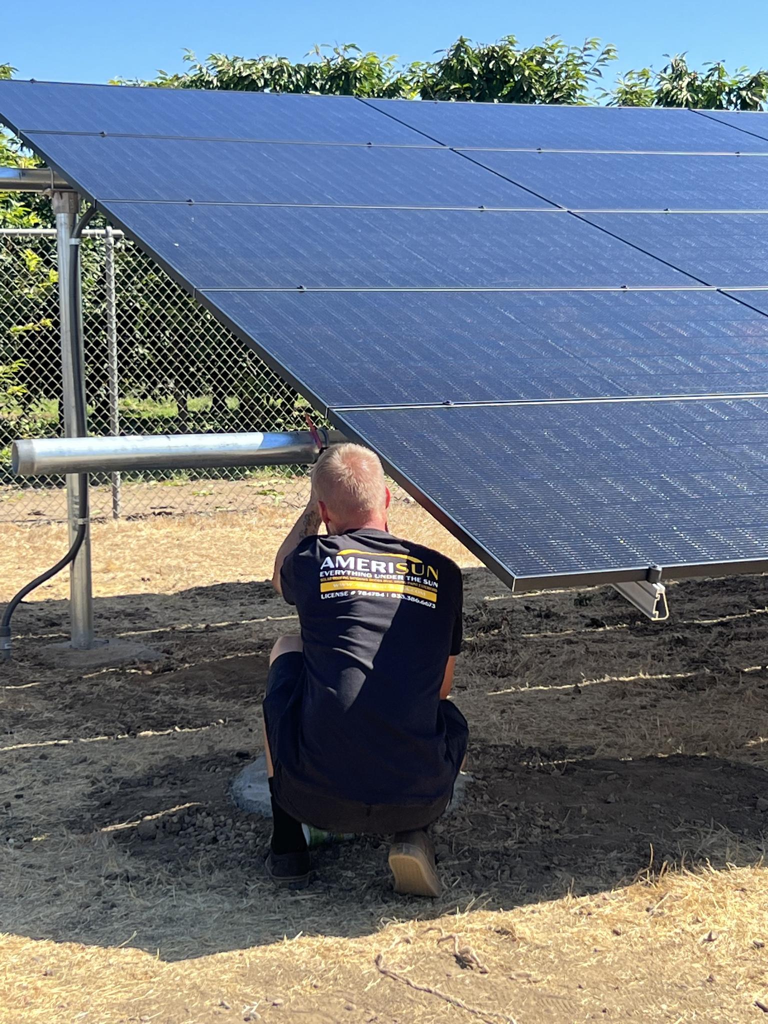 Hard at work installing a ground mount system