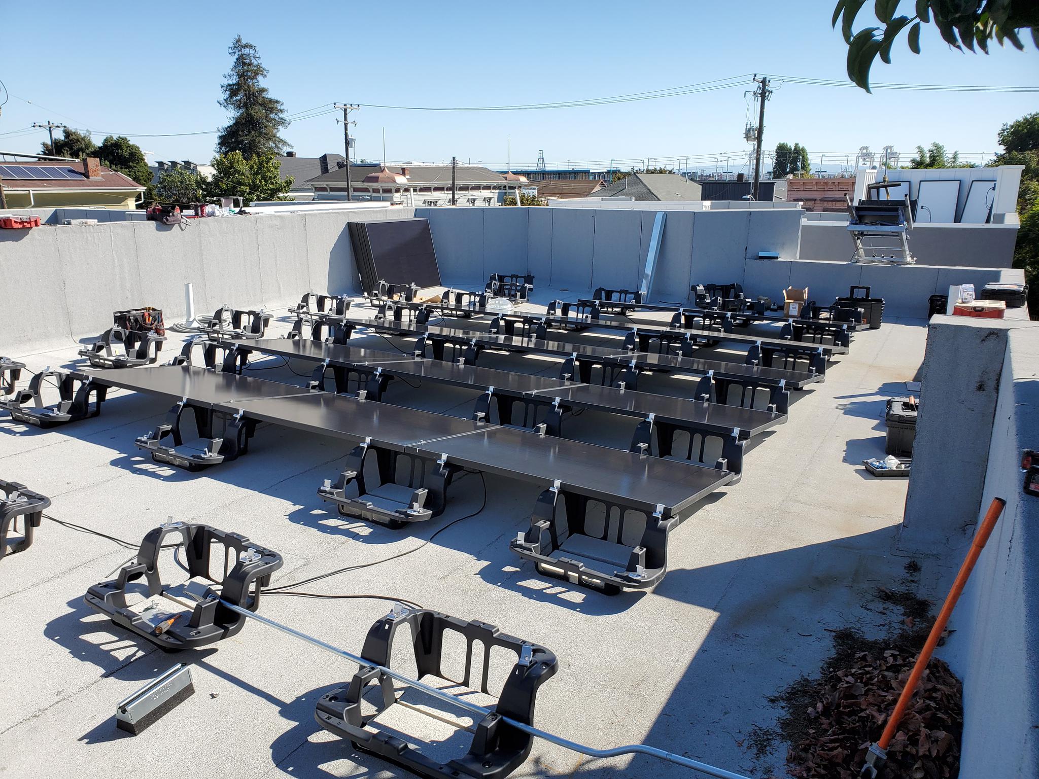 27 Solaria modules on flat roof, Oakland, CA in progress. enphase integrated micro inverters
