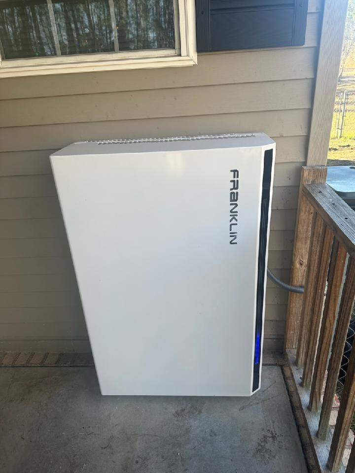 Keeping those assets covered: A Franklin WH battery on  on a cement porch for client to enjoy energy independence when they need to.